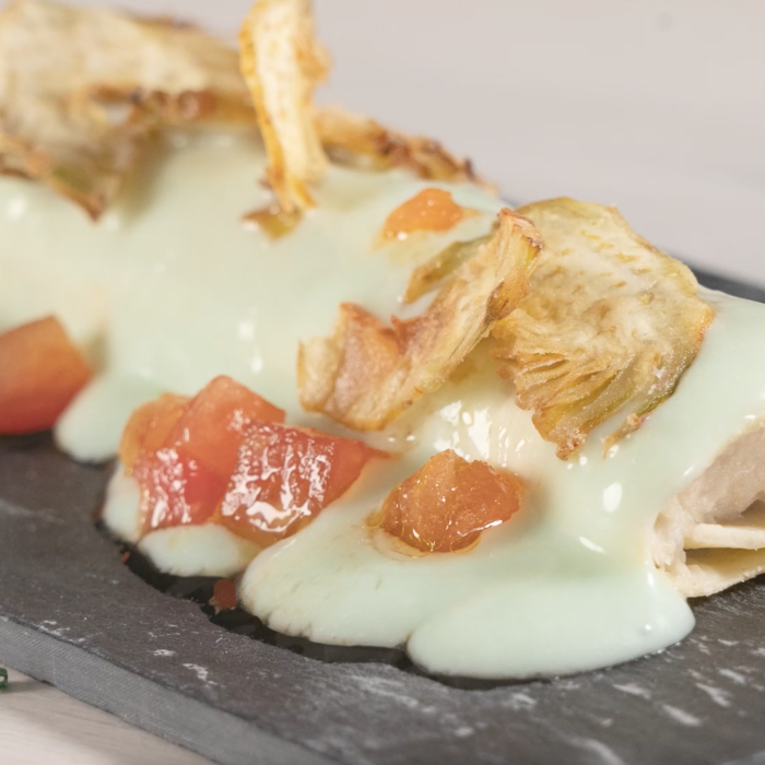 XXL Codfish Cannelloni with artichoke bechamel sauce, tomato and artichoke chips