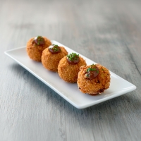 Croqueta Gastrobar La mini del Bistró con puré de vino tinto